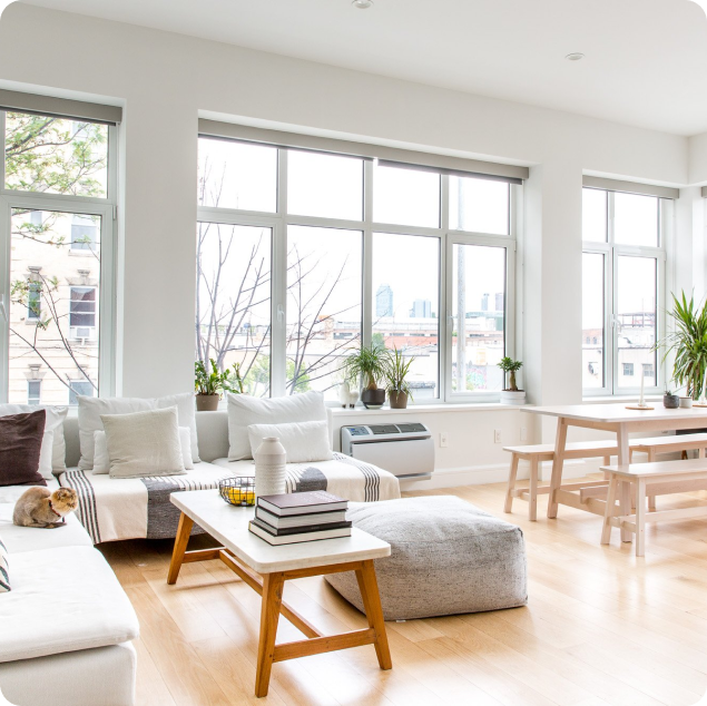 Bright and airy living space with clean decor and organized furniture after professional cleaning.