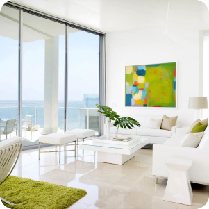 Bright and airy living room with ocean views, showcasing cleanliness after a professional cleaning.