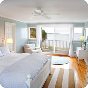 Bright and clean bedroom with a view, showcasing a tidy space after professional cleaning.