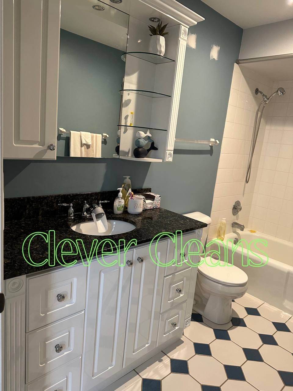 Photo of bathroom cleaning with spotless sink and mirror