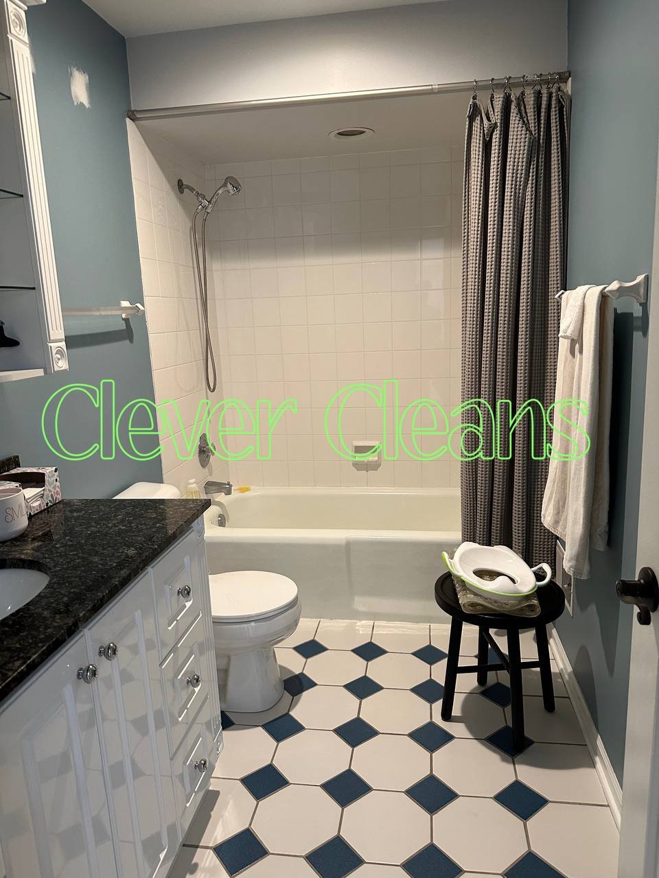 Photo of bathroom cleaning with organized surfaces and spotless tiles